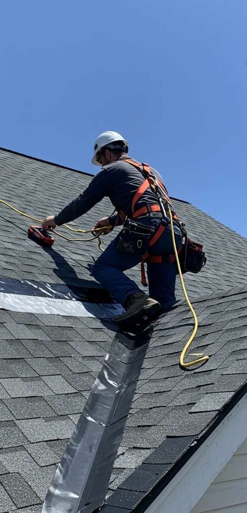 Freshly installed asphalt shingle roof on a suburban home